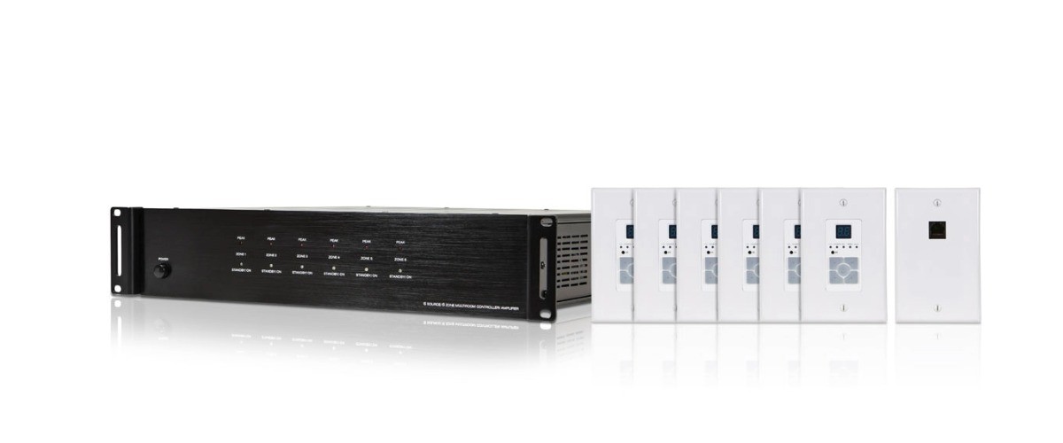 Audio distribution amplifier with wall-mounted control panels.